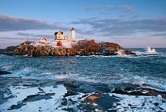 Maine's Nubble Lighthouse on Its Rocky Island During Winter